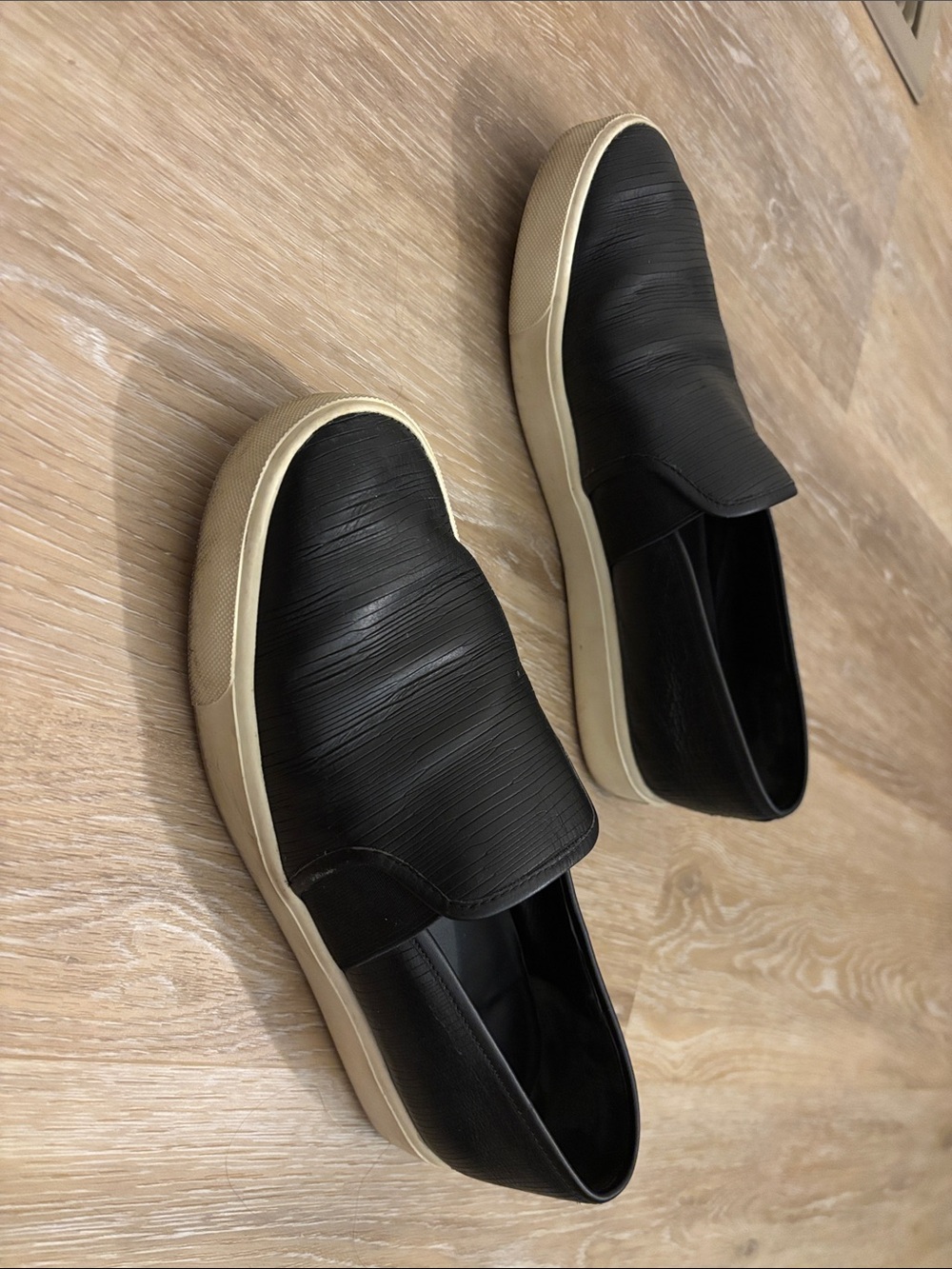 Women’s VINCE black leather slip on sneakers. Size 7